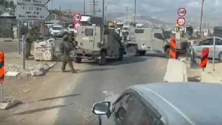 انقلاب مدرعة تابعة لجيش الاحتلال أثناء جرها سيارة مدنية فلسطينية